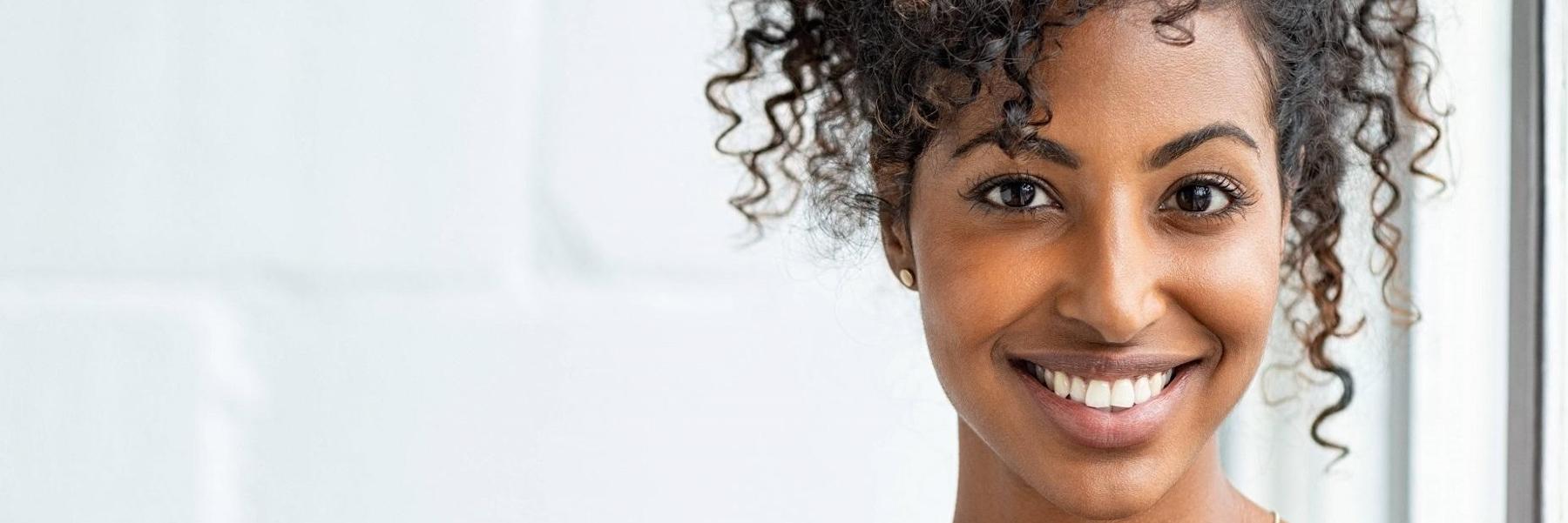 Woman smiling after dental cleaning at Randolph Dental Associates