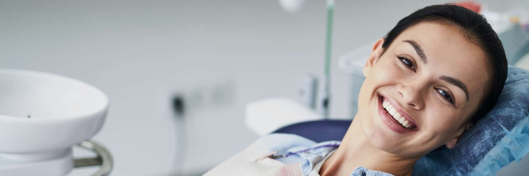 A woman in Randolph Dental Associates for a dental cleaning