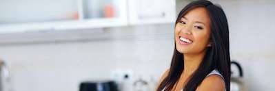 Lady smiling after getting Invisalign clear aligners from Randolph Dental Associates