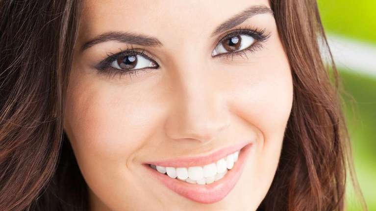 Lady smiling after getting porcelain veneers in Randolph, NJ