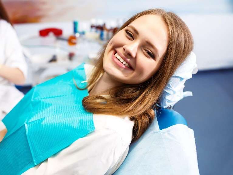 A happy patient after check up at Randolph Dental Associates
