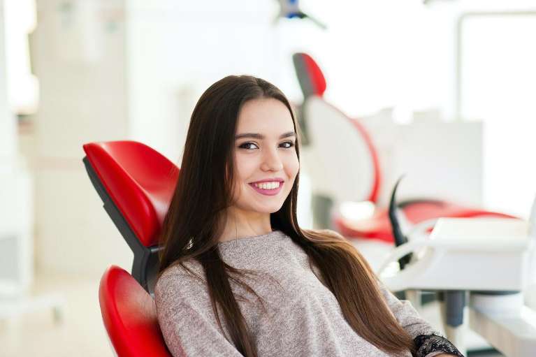 A woman smiling after getting Dental Implants in Randolph, NJ