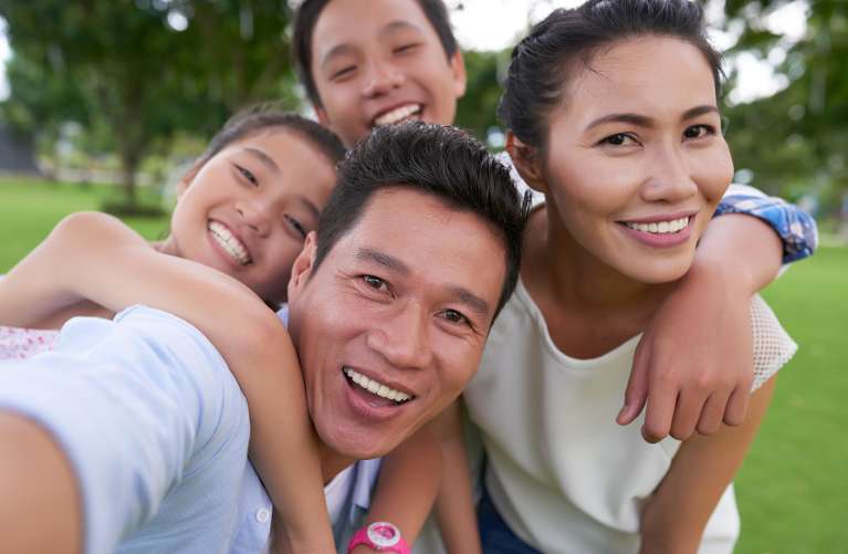 A happy family after a Local Dentist visit for their Teeth Cleaning