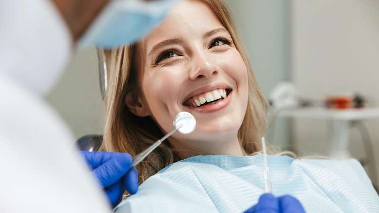 A patient undergoing dental examination at Randolph Dental Associates