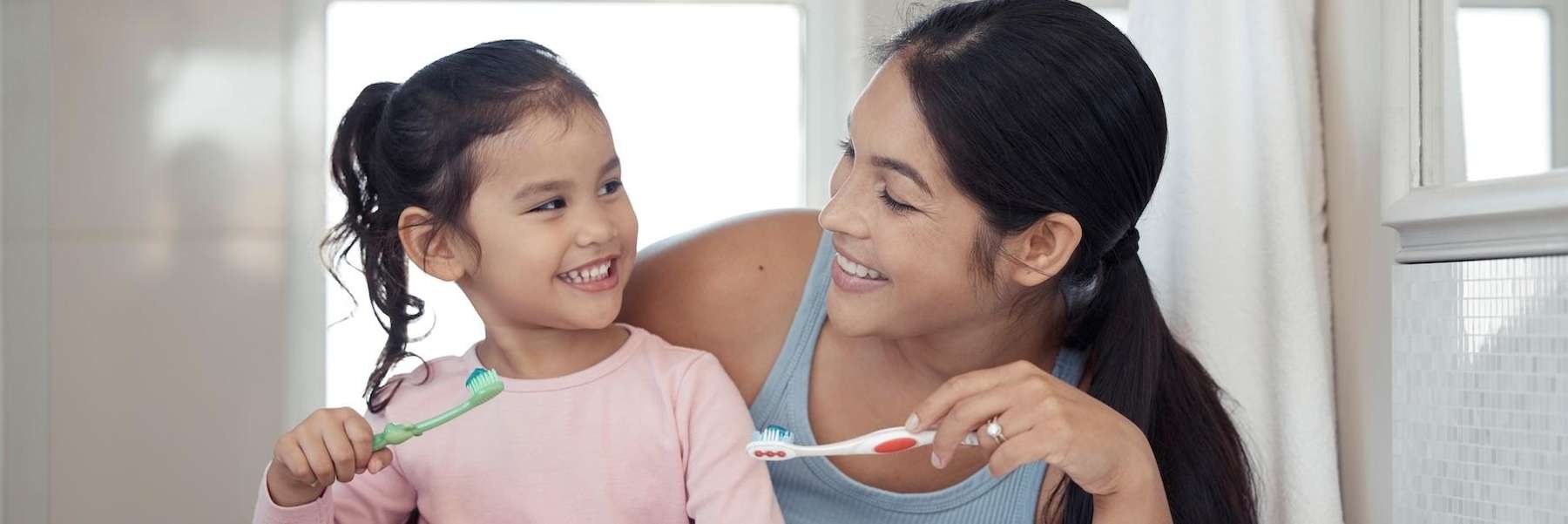 A mother and daughter brushing their teeth in Randolph, NJ