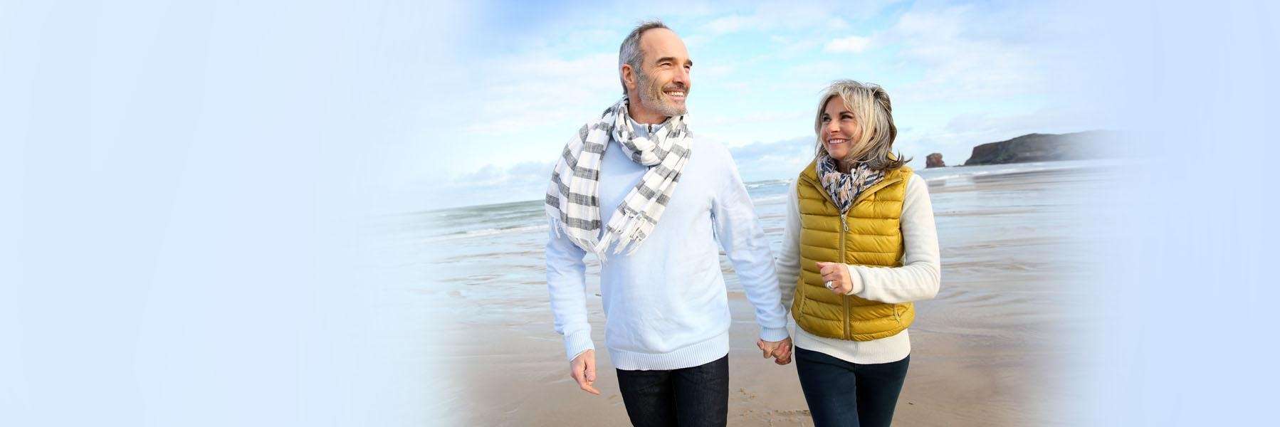 Couple enjoying a walk after getting dental implants from Randolph Dental Associates