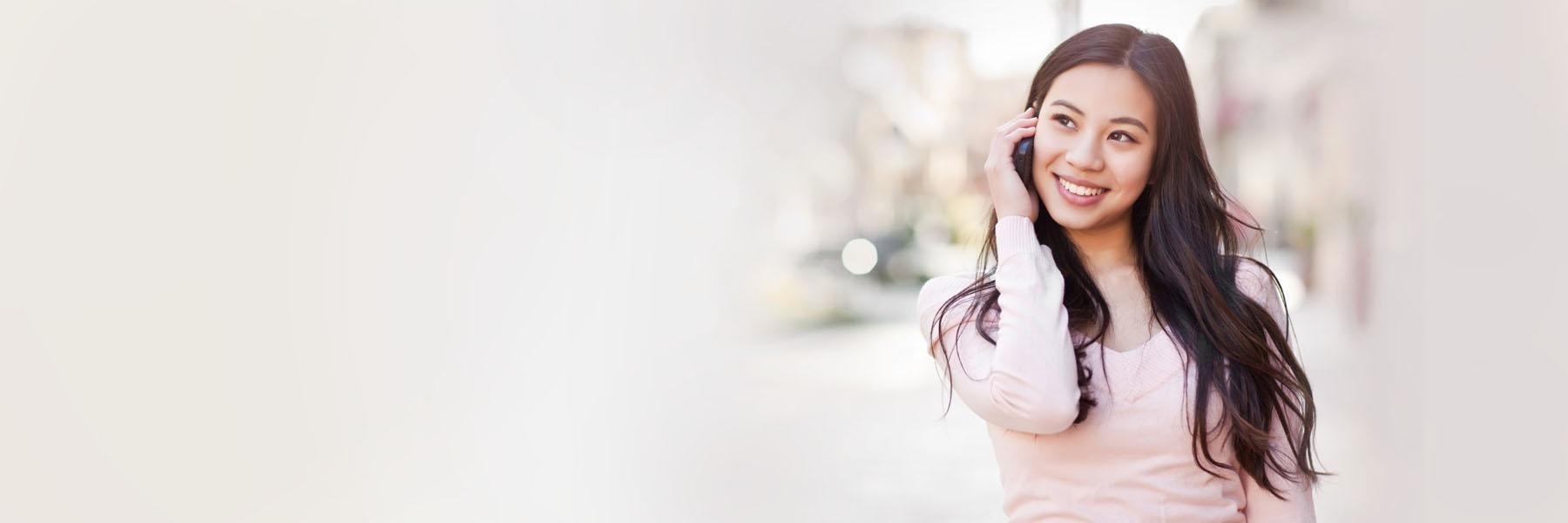 woman talking on phone during dental emergency