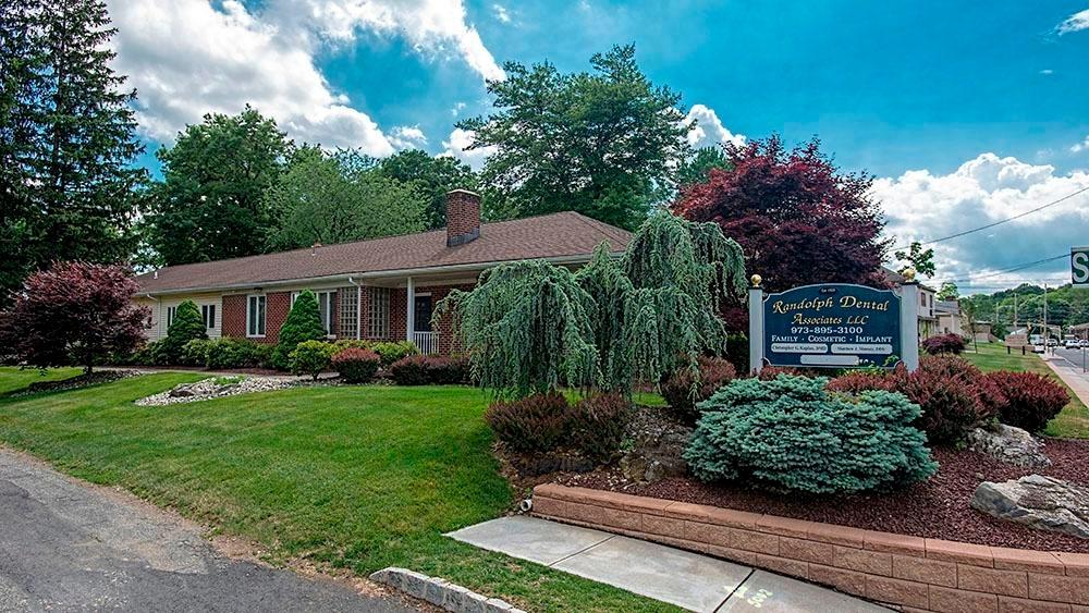 Exterior shot of dental office and sign for Randolph Dental Associates
