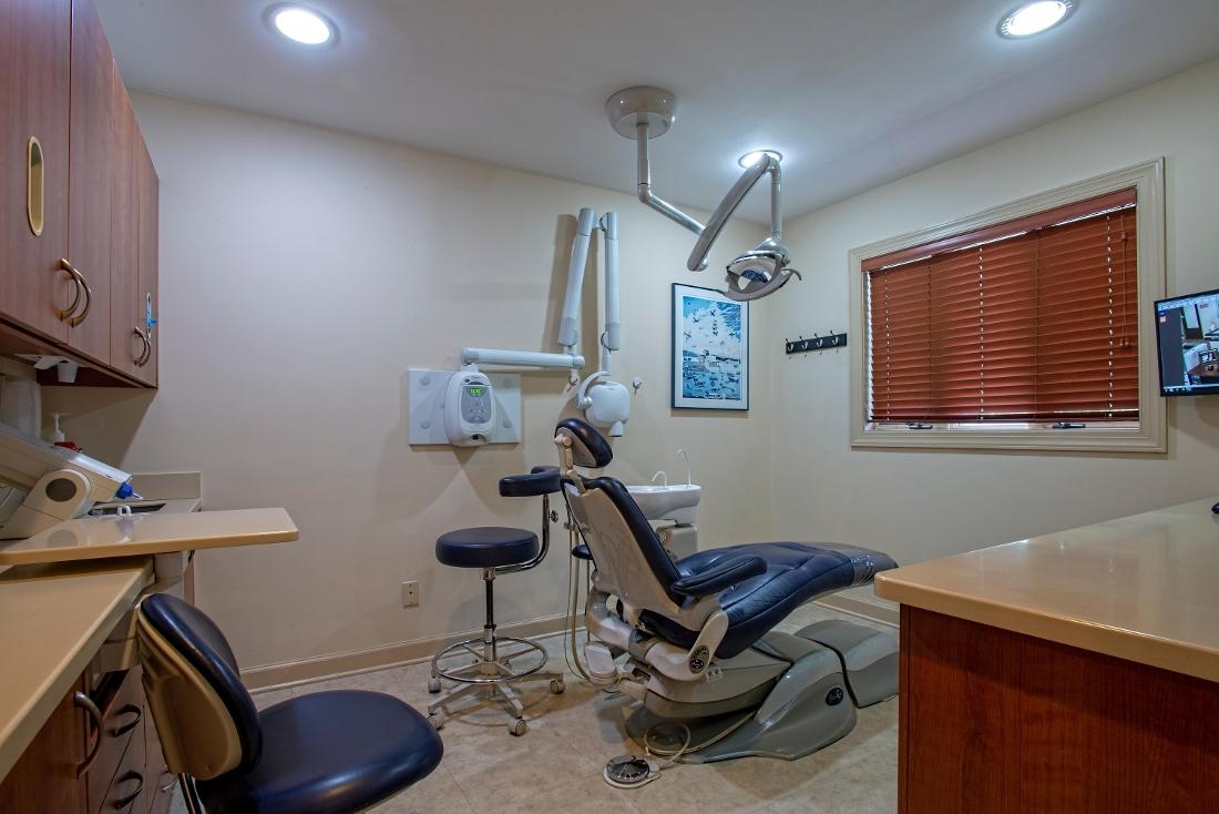 dental treatment room with chair and light at randolph dental associates